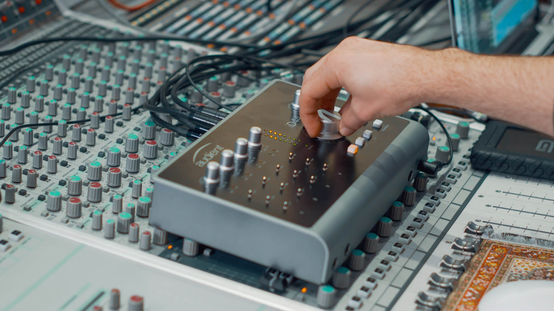 Damien Lewis' hand mixing on Audient iD44 audio interface