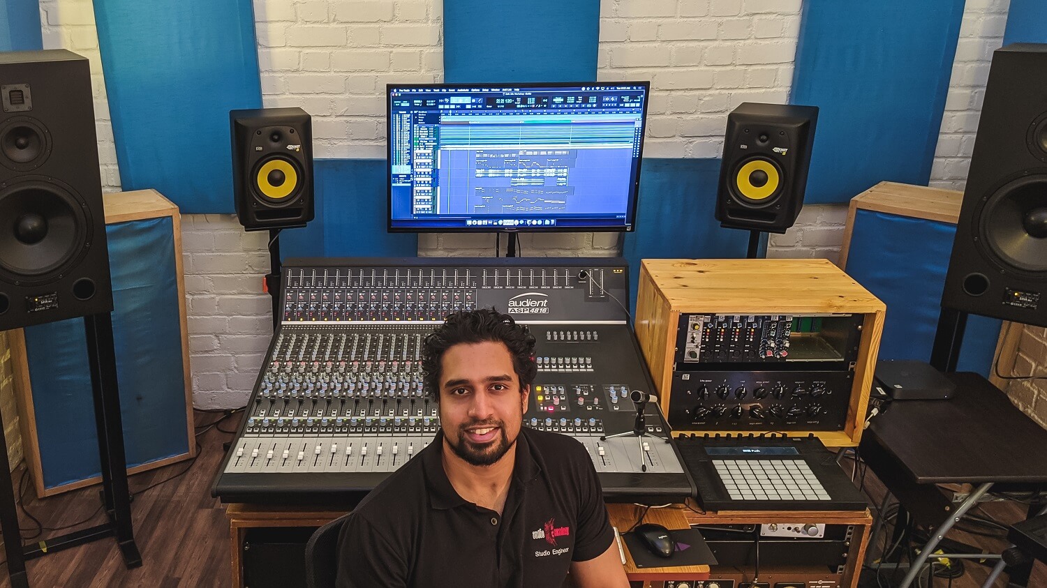 Man at Audient ASP4816 mixing console at Audio Academy in India