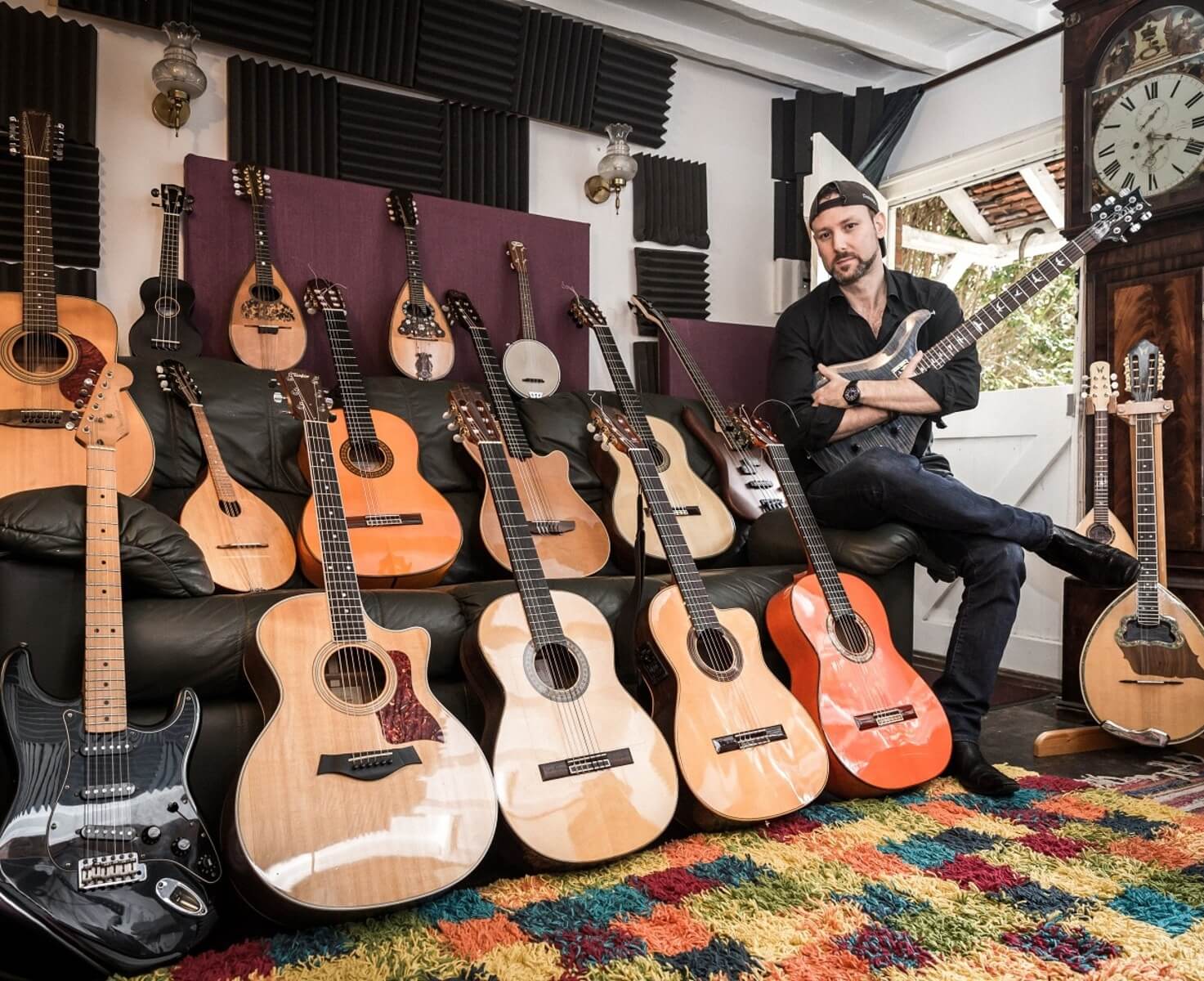 Tony Calvo and some of his guitars in his home studio where he recorded Latin Guitar Underworld library album