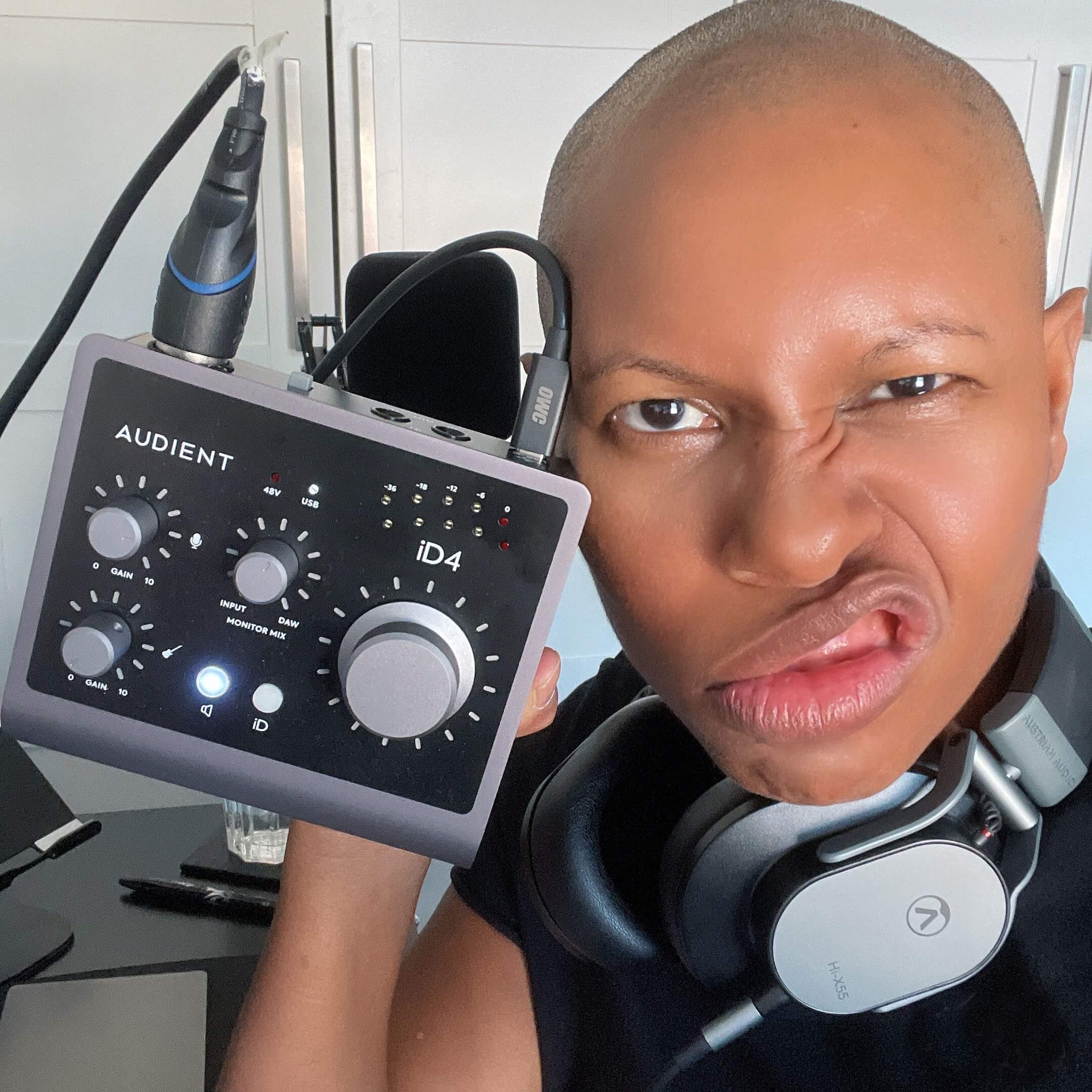Skunk Anansie vocalist SKIN wearing headphones pulls a face with her iD4 audio interface