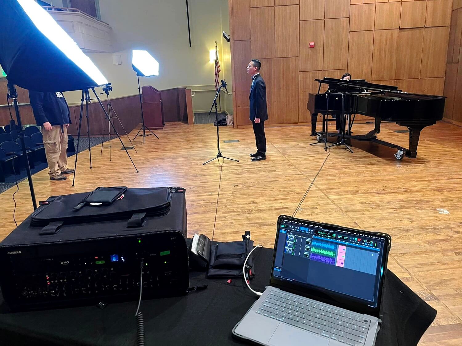 Evan Jones' recording a singer & grand piano with mobile rig in a hall 