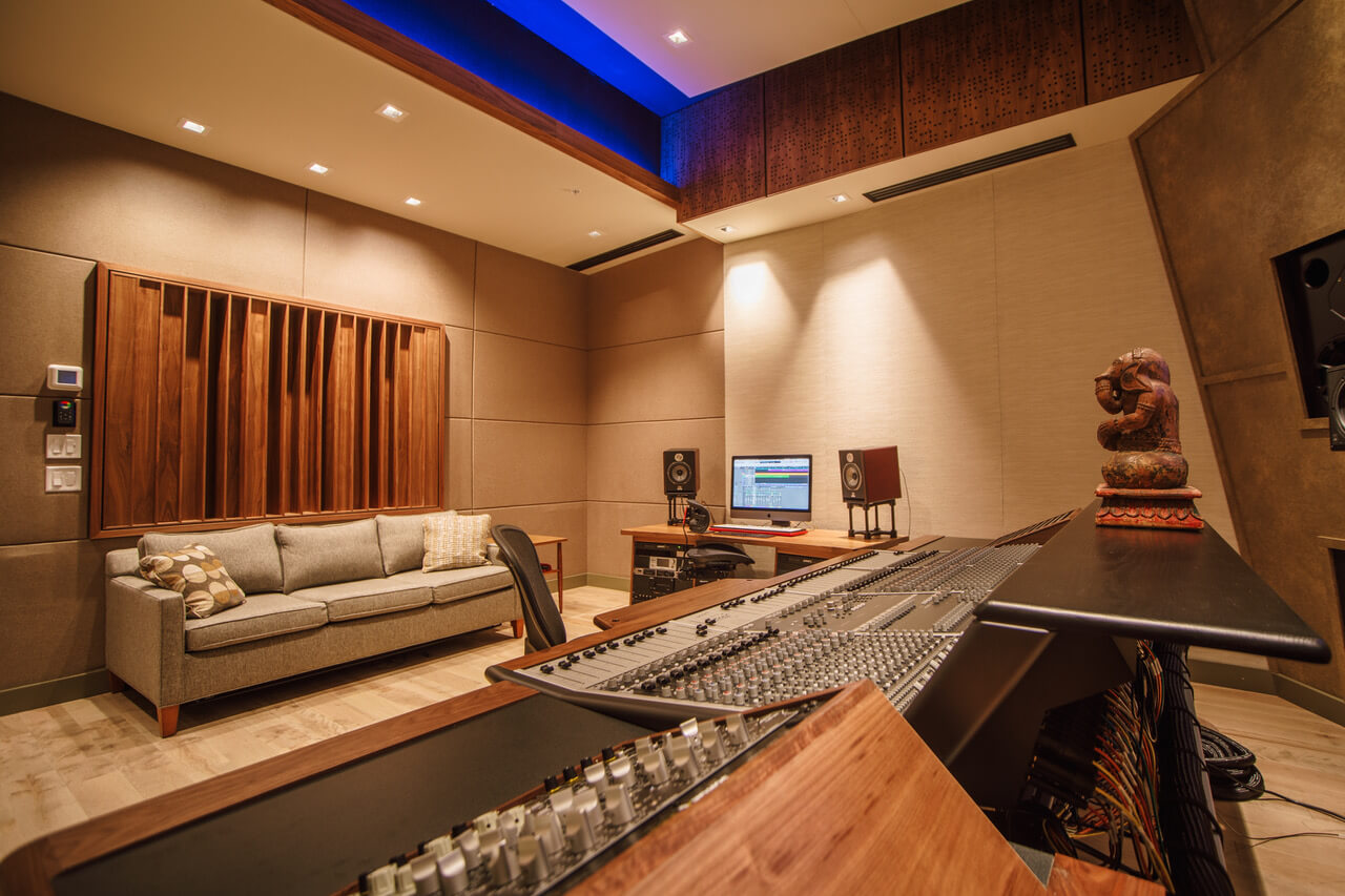 The Control Room at Expanding Sky Studio featuring a large format mixing console, lots of outboard and a comfy sofa 