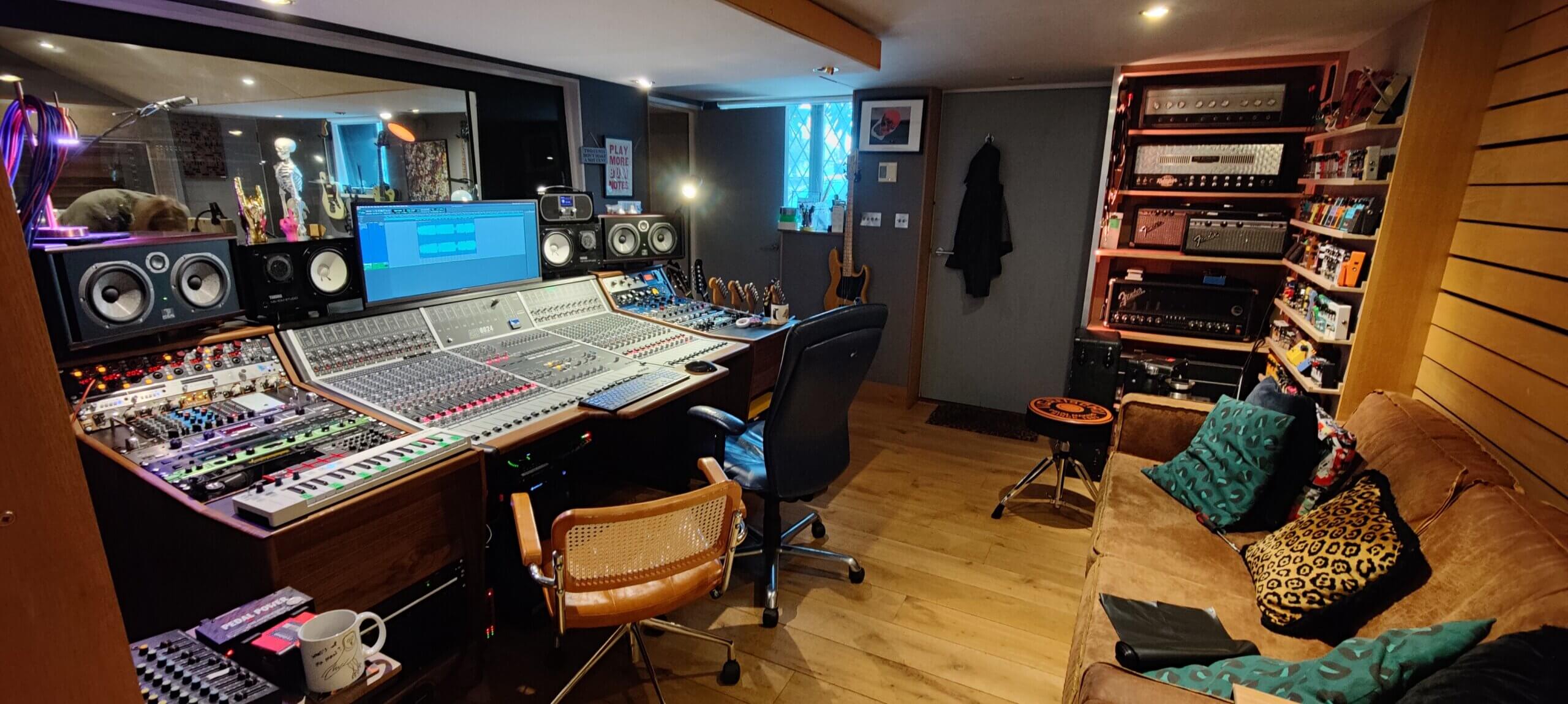 Cozy recording studio packed with kit featuring large format recording console at its heart