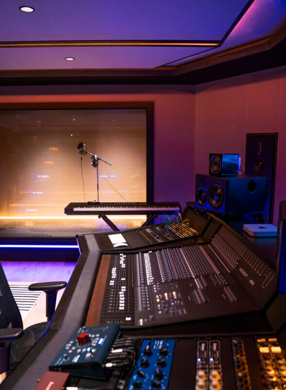 Runway Recording Studio - side view of console with rack of outboard in foreground all bathed in soft purple light