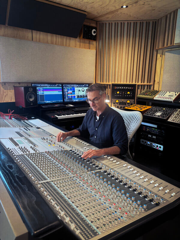 Greg von Menge sitting at his ASP8024 Classic console surrounded by studio gear