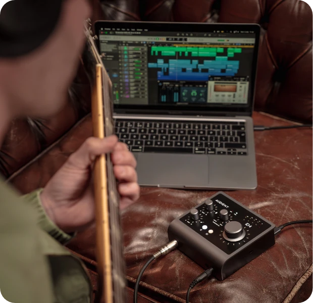 A guitarist using the iD4 Audio Interface