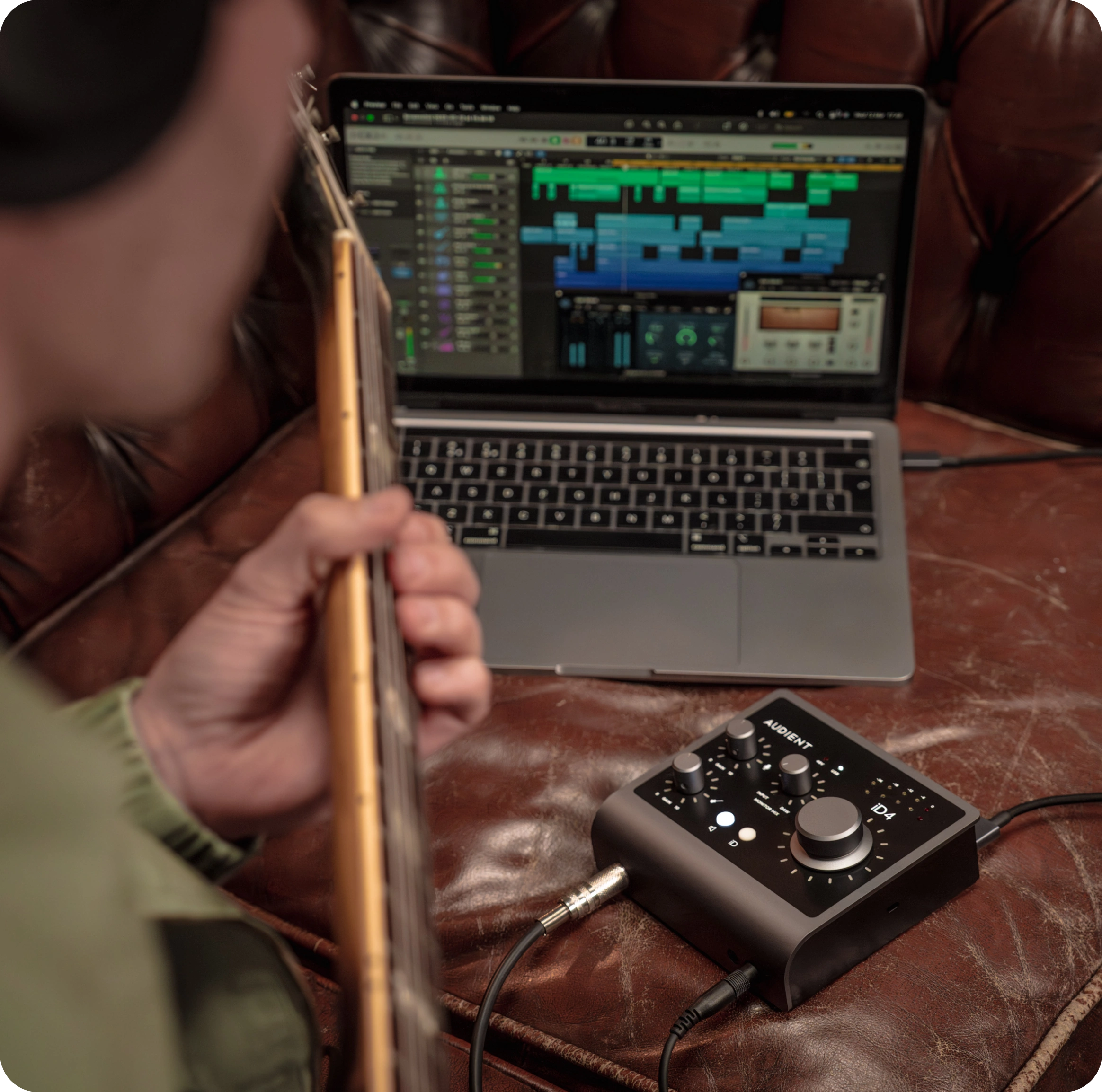 A guitarist using the iD4 Audio Interface